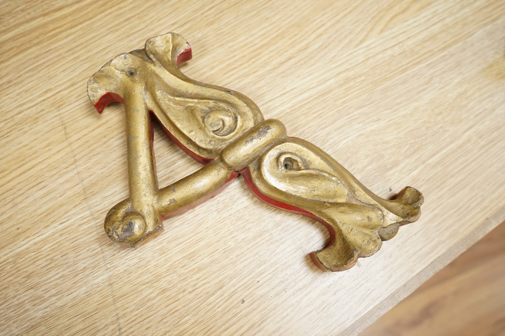 A quantity of decorative carved, painted and gilt carnival letters, each approximately 23cm high